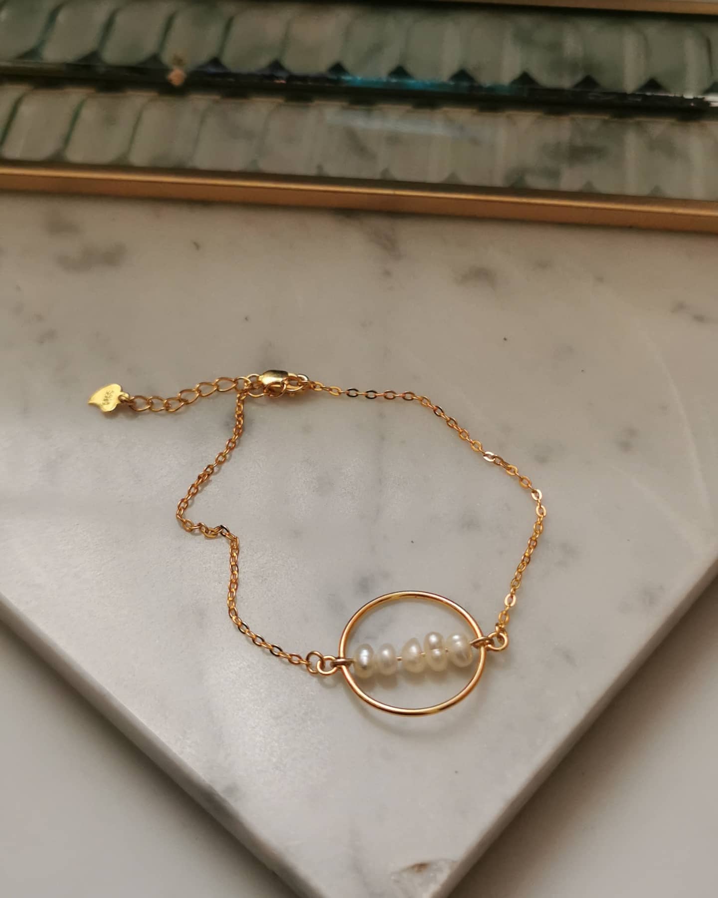 sterling silver 24k gold paltered bracelet with natural freshwater pearls.